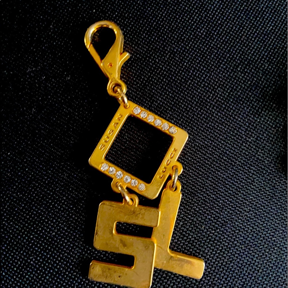 Susan Lucci purse handing pendant
